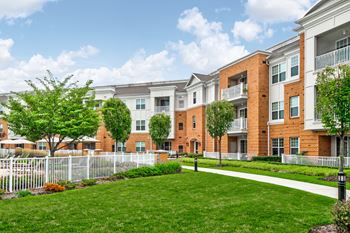 Apartment building exterior with landscaped courtyard